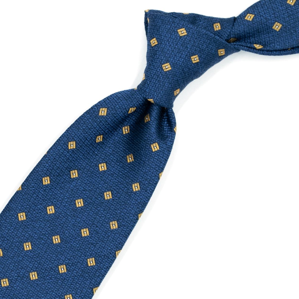 Light blue tie with yellow squares and white dots