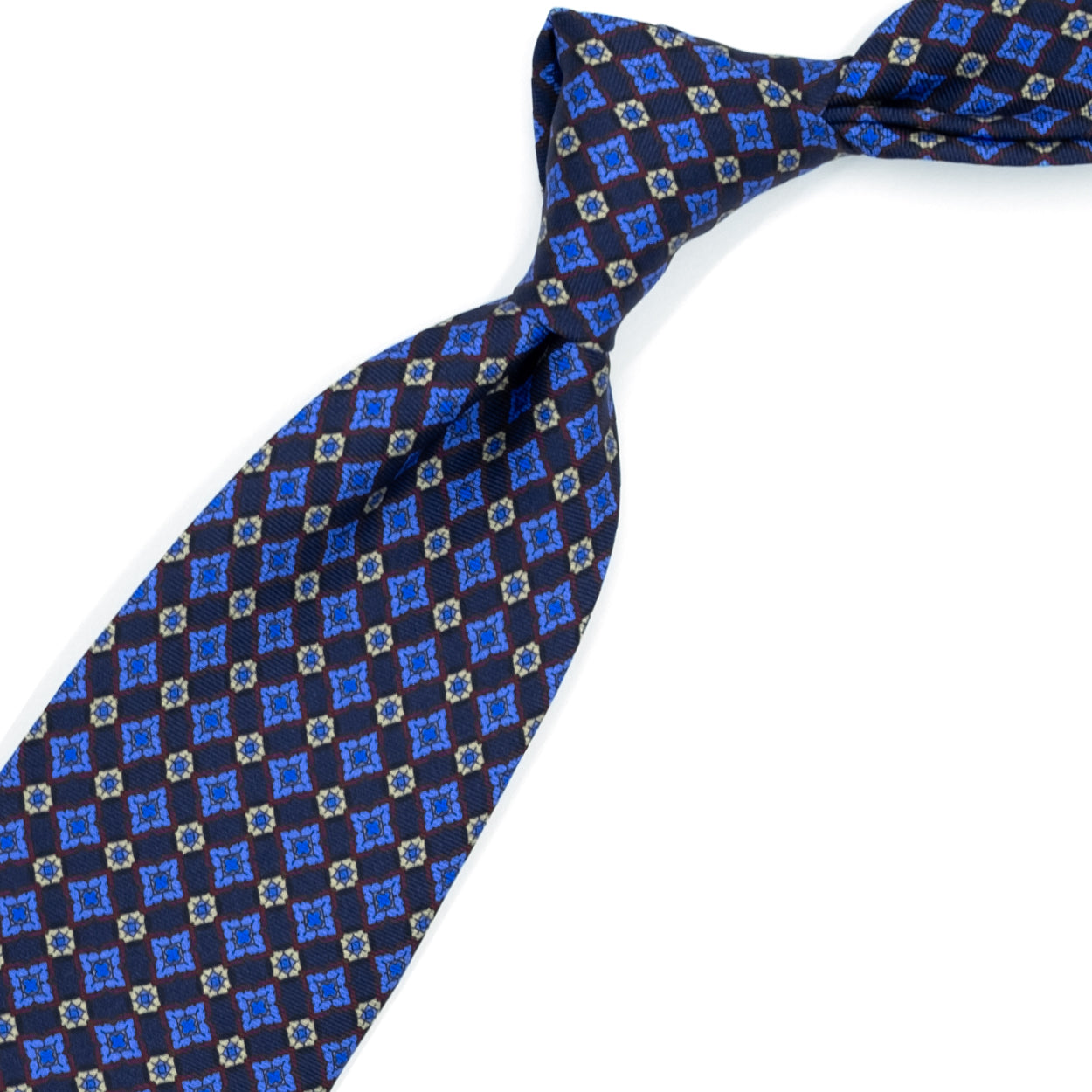 Blue tie with light blue, cream and burgundy pattern