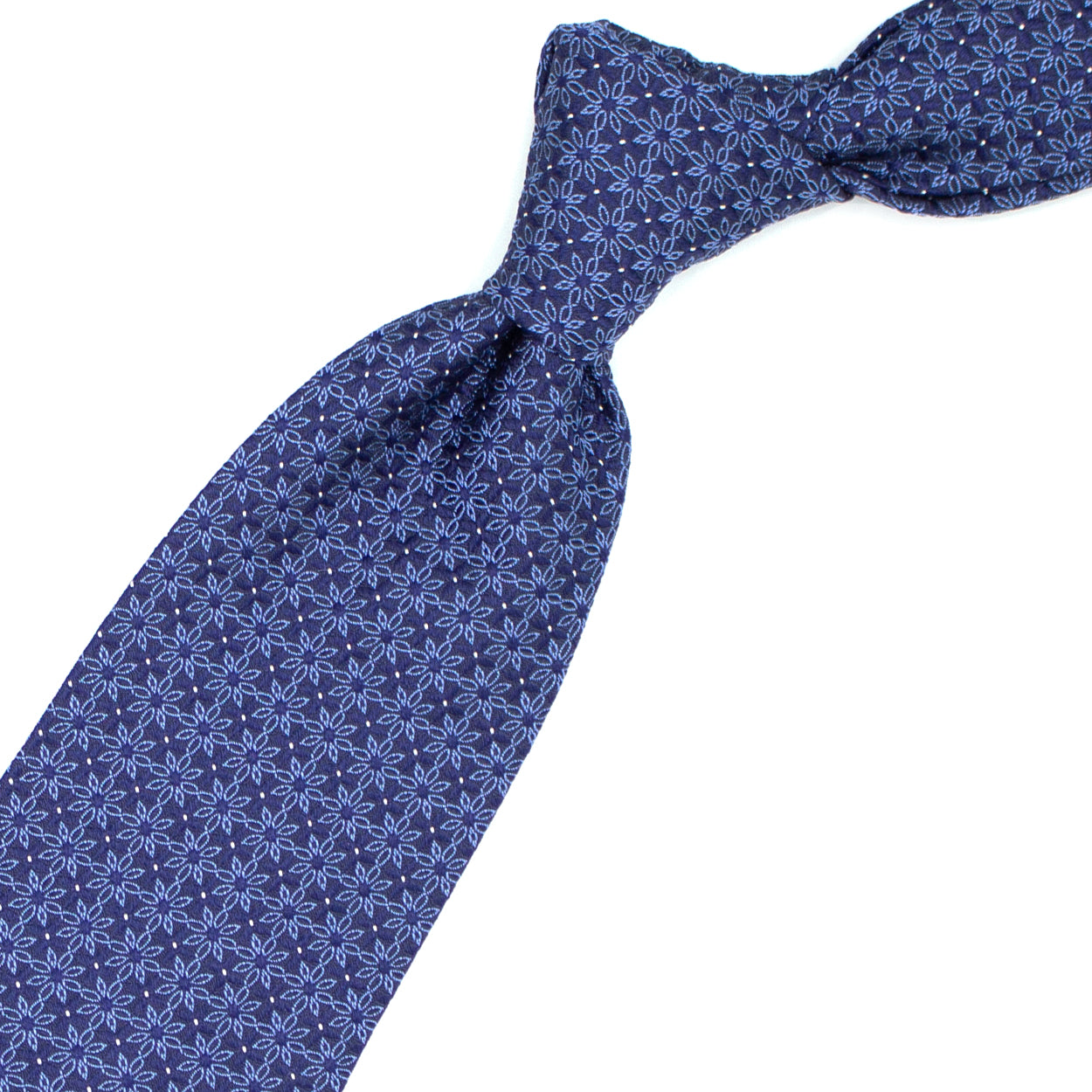 Blue tie with blue flowers and white dots