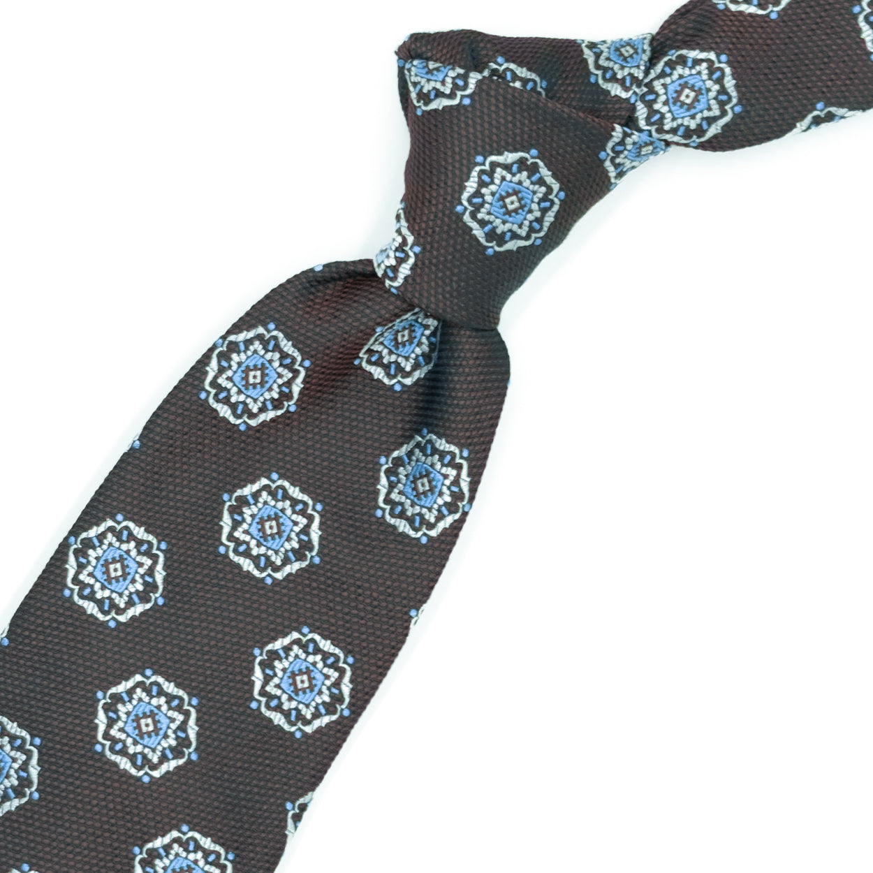 Brown tie with white and blue medallions