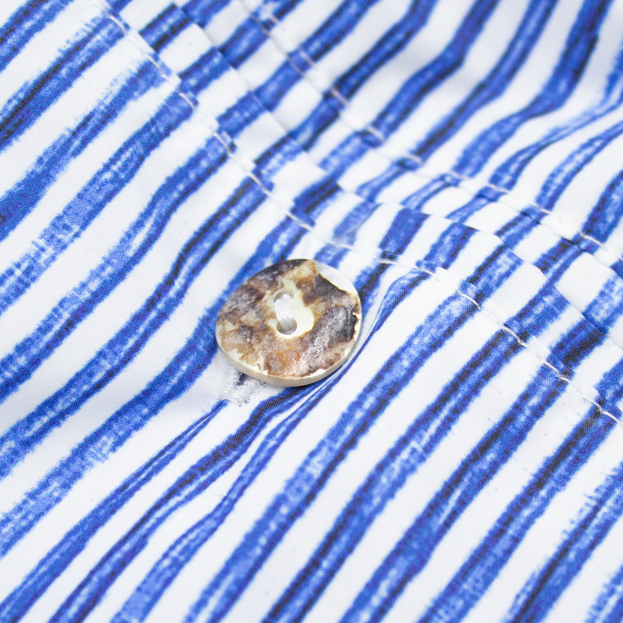 White swimming costume with blue stripes