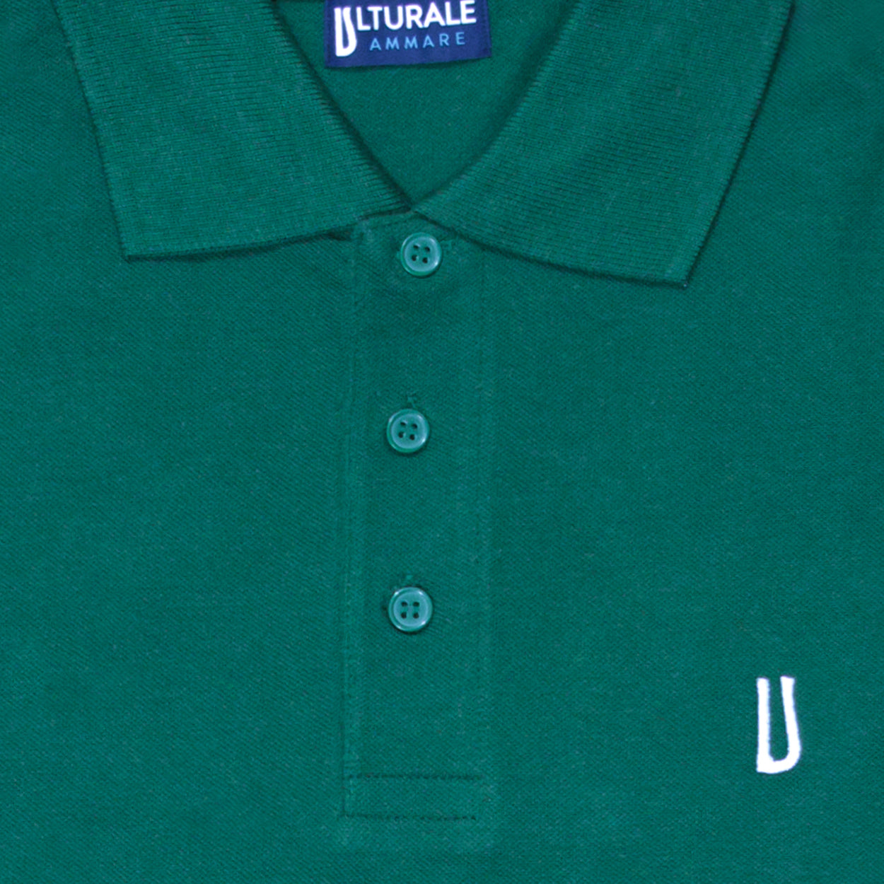 Green polo shirt with white Ulturale logo